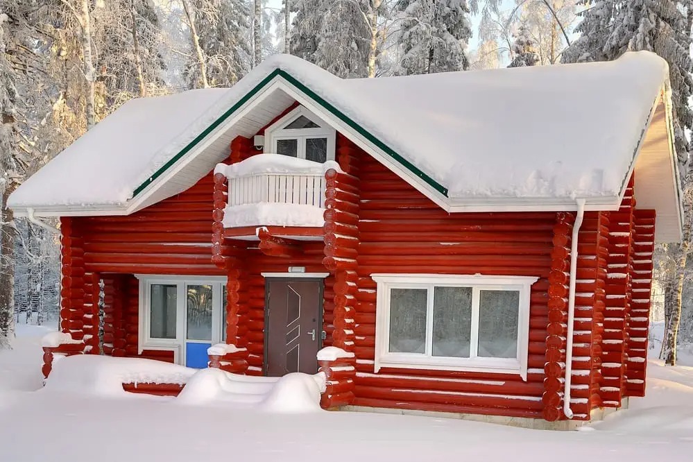 A log cabin painted red