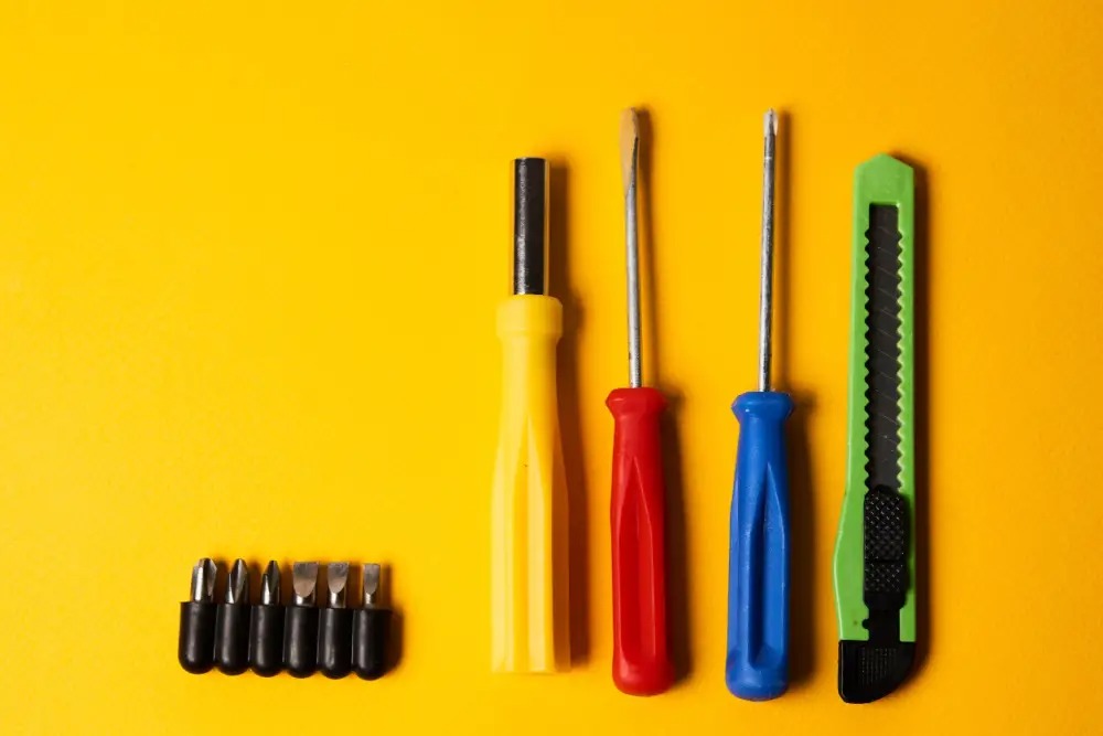 A variety of tools on a yellow background