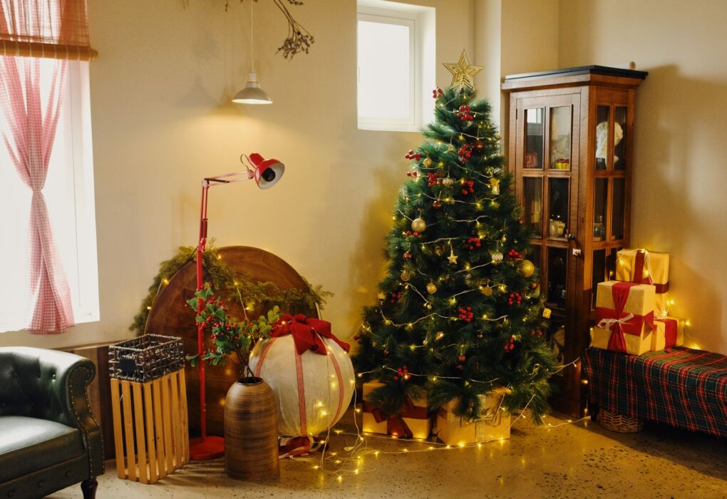 A decorated artificial Christmas tree in a living room