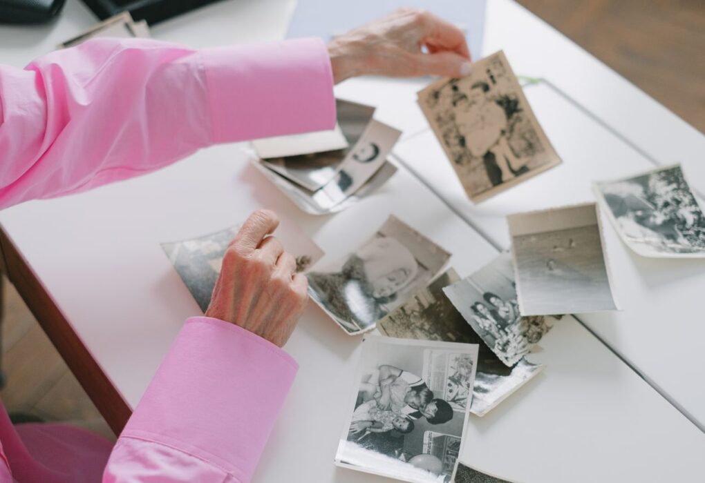 Woman looking at old family photos