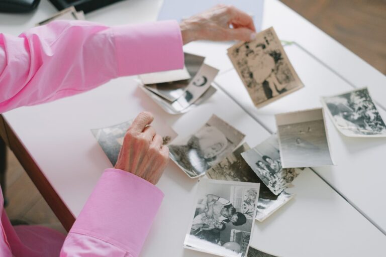 Woman looking at old family photos