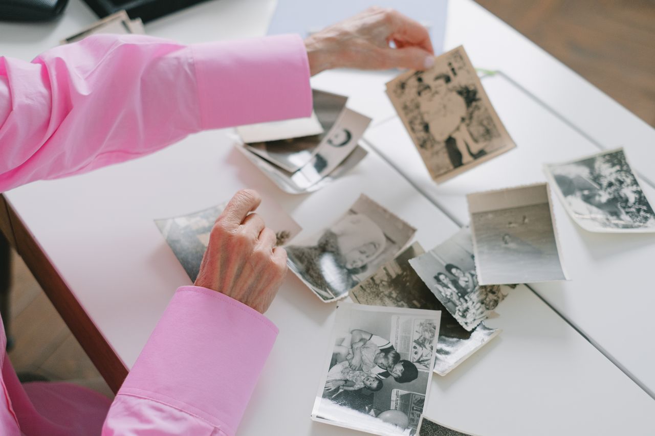 Woman looking at old family photos